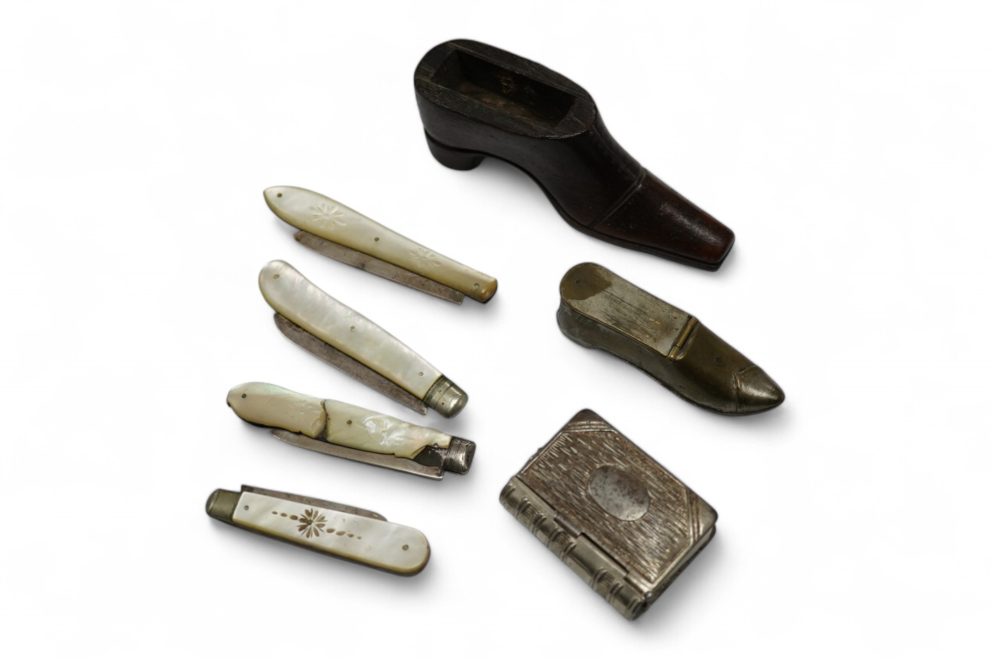 Four mother-of-pearl penknives, two vesta cases and a treen shoe, treen shoe 10cm long. Condition - fair